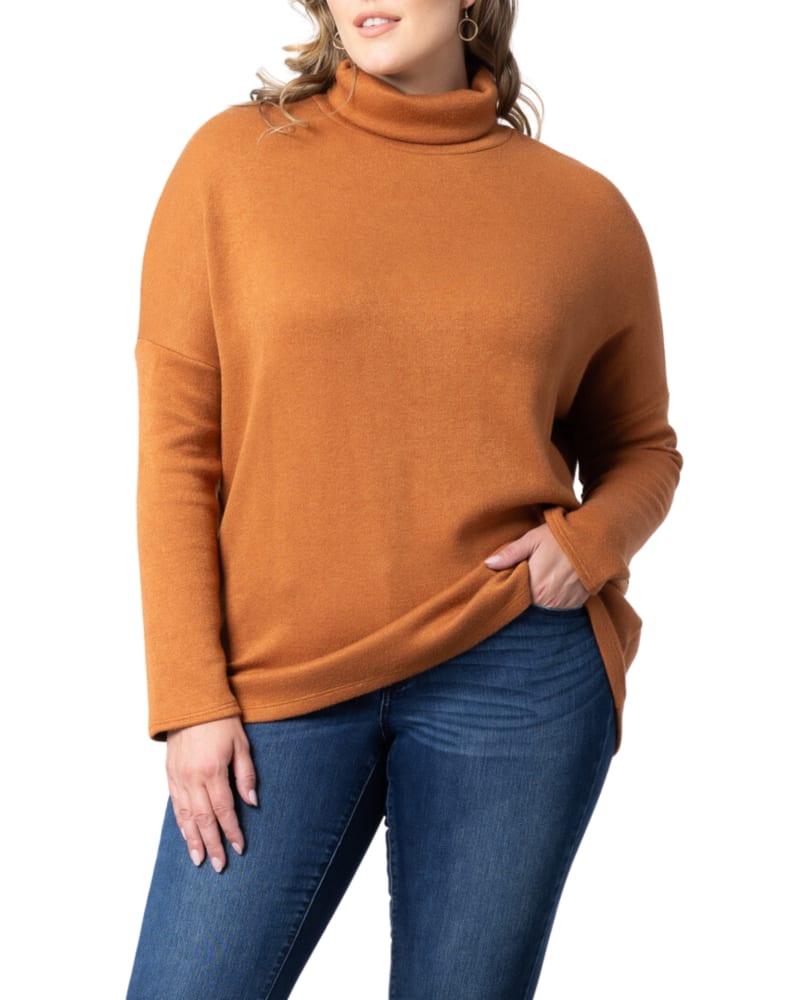 Front of a model wearing a size 2X Paris Turtleneck Tunic Sweater in CAMEL by Kiyonna. | dia_product_style_image_id:316154